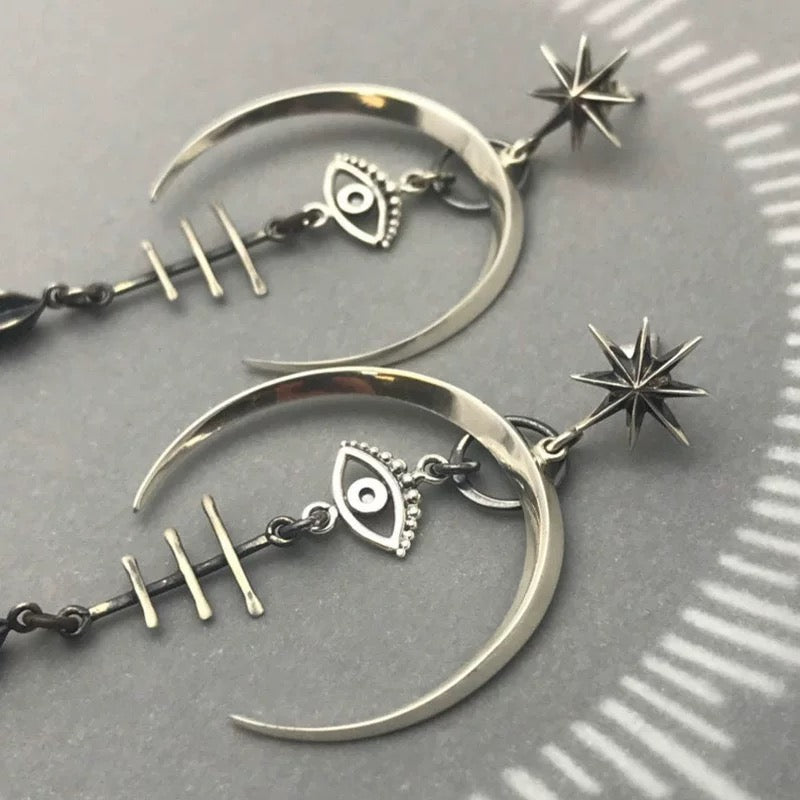 Unleash Your Inner Demon: Gothic Devil's Eye Earrings for a Dark and Edgy Look